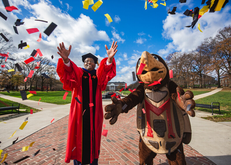 president and testudo throw confeetti on mall